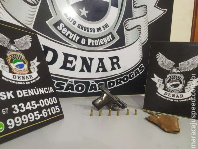 Investigação da polícia prende homem portando arma de fogo