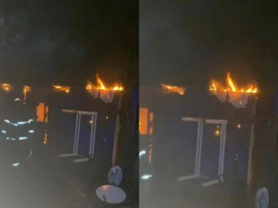 Mulher é resgatada de casa em chamas abraçada com os 4 filhos
