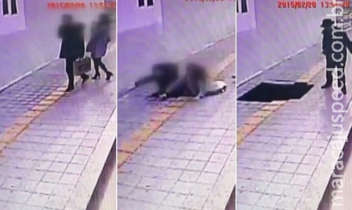 Buraco é aberto de repente em calçada e engole casal Buraco é aberto de repente em calçada e engole casal