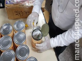 Polícia paraguaia encontra maconha em latas de pêssegos e xarope de cana Polícia paraguaia encontra maconha em latas de pêssegos e xarope de cana