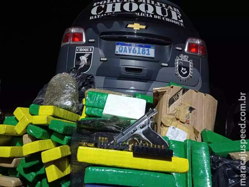 Suspeito é preso com arma e drogas em casa ao ser visto descarregando caixas