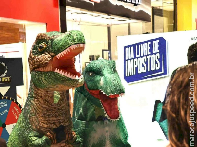 Campanha usa dinossauros para chamar a atenção para a carga tributária em MS Campanha usa dinossauros para chamar a atenção para a carga tributária em MS
